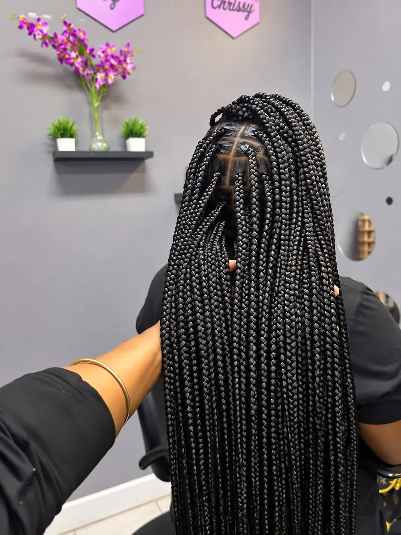 Long black knotless braids seen from behind